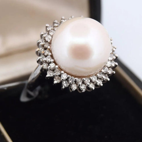 Bague 60 Bague en or 18 carats avec perle de culture et diamants 58 Facettes