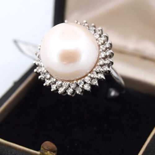 Bague 60 Bague en or 18 carats avec perle de culture et diamants 58 Facettes