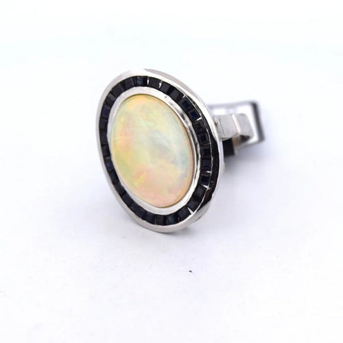 Bague 54 Bague vintage en platine ornée d’opale, d’onyx et de saphirs 58 Facettes