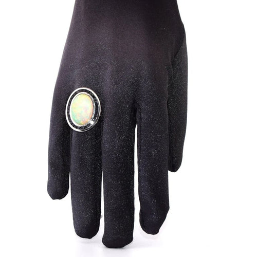Bague 54 Bague vintage en platine ornée d’opale, d’onyx et de saphirs 58 Facettes