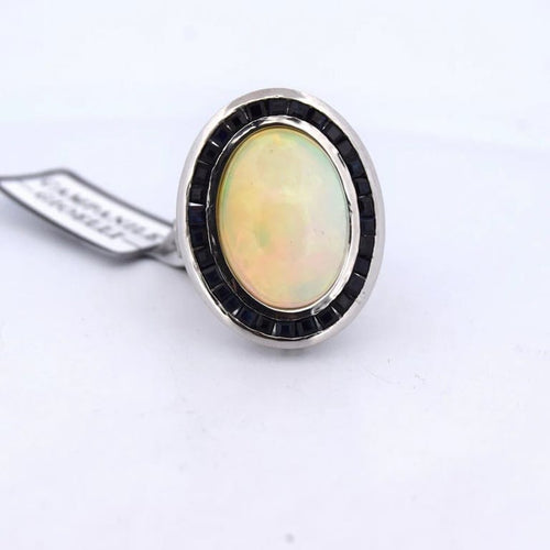 Bague 54 Bague vintage en platine ornée d’opale, d’onyx et de saphirs 58 Facettes