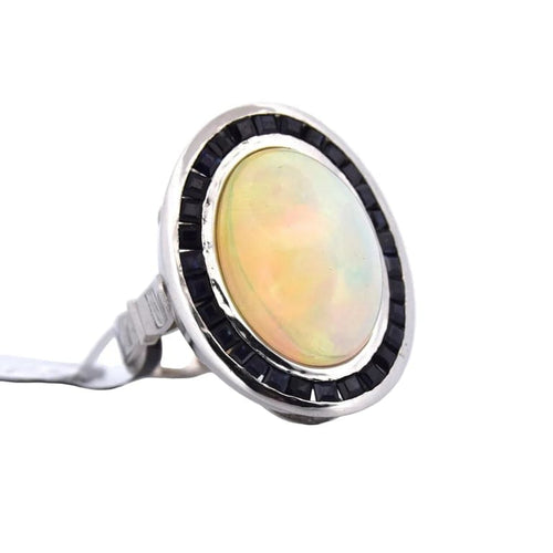Bague 54 Bague vintage en platine ornée d’opale, d’onyx et de saphirs 58 Facettes