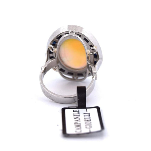 Bague 54 Bague vintage en platine ornée d’opale, d’onyx et de saphirs 58 Facettes