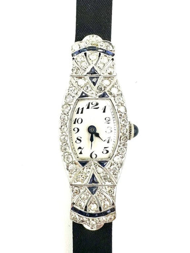 Montre Montre Art déco tonneau en platine, diamants et saphirs 58 Facettes