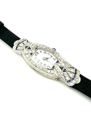 Montre Montre Art déco tonneau en platine, diamants et saphirs 58 Facettes