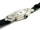 Montre Montre Art déco tonneau en platine, diamants et saphirs 58 Facettes