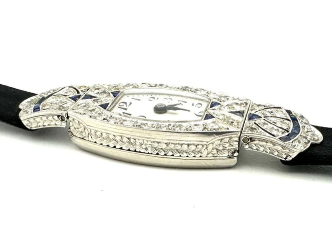 Montre Montre Art déco tonneau en platine, diamants et saphirs 58 Facettes