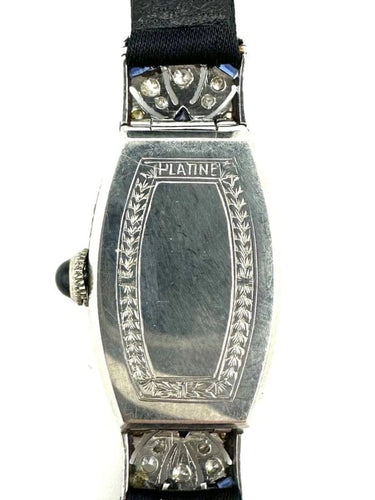 Montre Montre Art déco tonneau en platine, diamants et saphirs 58 Facettes