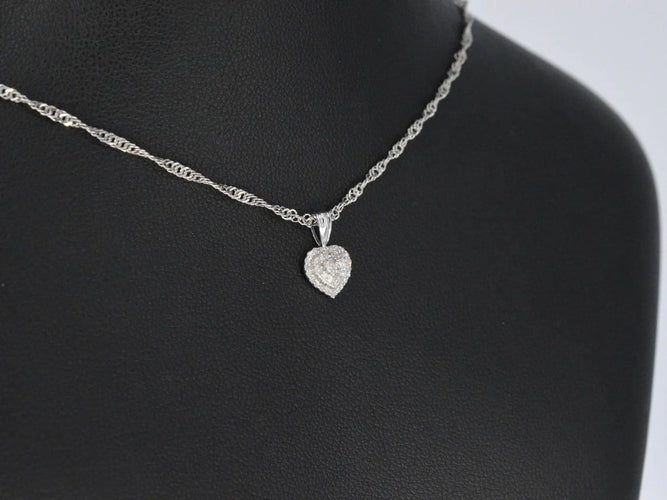 Pendentif Pendentif cœur en or blanc et diamants 58 Facettes 2078