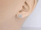 Boucles d'oreilles Boucles d'oreilles en or blanc 14 carats avec diamants taille brillant 58 Facettes 2075
