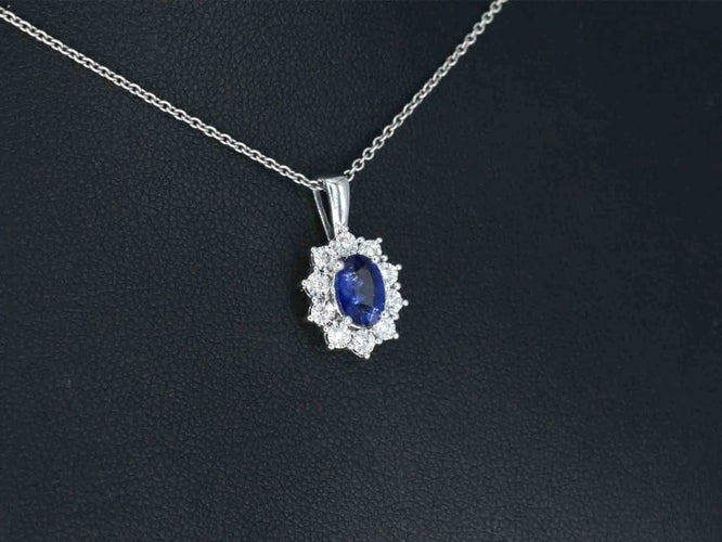 Pendentif Pendentif en or blanc 14 carats avec diamants et saphir 58 Facettes 2299