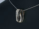 Pendentif Pendentif design en or rose 18 carats avec diamants blancs et noirs 58 Facettes 2245