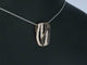 Pendentif Pendentif design en or rose 18 carats avec diamants blancs et noirs 58 Facettes 2245