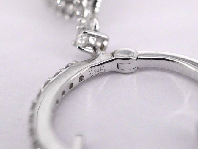 Boucles d'oreilles Boucles d'oreilles en forme de larme en or blanc 14 carats et diamants 58 Facettes 2055