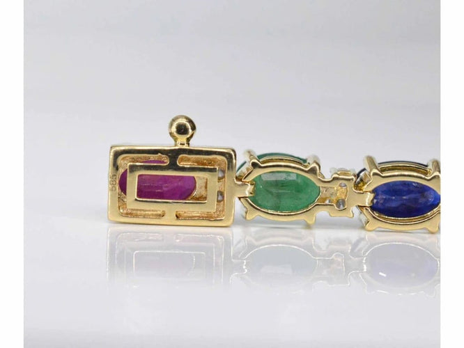 Bracelet Bracelet tennis en or 14 carats avec diamants, saphirs, rubis et émeraudes 58 Facettes 2069