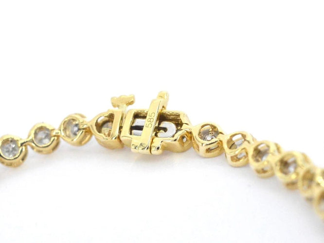 Bracelet Bracelet en or jaune 14 carats serti de diamants 58 Facettes 2172