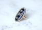 Bague 61 Bague navette XVIIIe siècle en or rose, argent, émail bleu et diamants 58 Facettes