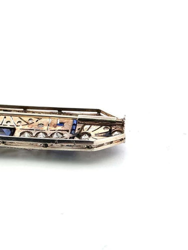 Broche Broche années 1940 en or blanc 18 carats, saphirs et diamants 58 Facettes