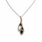 Pendentif Pendentif en or blanc 750 avec opale blanche, grenat et diamants 58 Facettes 50352