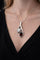 Pendentif Pendentif en or blanc 750 avec opale blanche, grenat et diamants 58 Facettes 50352
