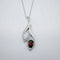 Pendentif Pendentif en or blanc 750 avec opale blanche, grenat et diamants 58 Facettes 50352