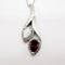 Pendentif Pendentif en or blanc 750 avec opale blanche, grenat et diamants 58 Facettes 50352