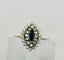 Bague 55 Bague en or blanc 750 avec saphir marquise et halo de diamants 58 Facettes 50293
