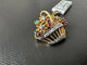 Broche Broche giardinetto en or blanc et or jaune 18 carats avec pierres précieuses 58 Facettes