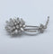 Broche Broche motif floral en platine et diamants 58 Facettes 250194