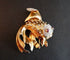 Broche Broche poisson rubis et diamants en platine et or jaune 18 carats 58 Facettes 1026794
