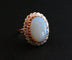 Bague 49 Bague fleur opale cabochon et diamants en or jaune 18 carats 58 Facettes
