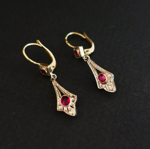 Boucles d'oreilles Boucles d’oreilles dormeuses en or 18 carats bicolore et pierres rouges 58 Facettes