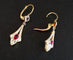Boucles d'oreilles Boucles d’oreilles dormeuses en or 18 carats bicolore et pierres rouges 58 Facettes