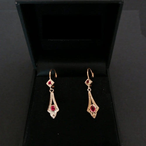 Boucles d'oreilles Boucles d’oreilles dormeuses en or 18 carats bicolore et pierres rouges 58 Facettes