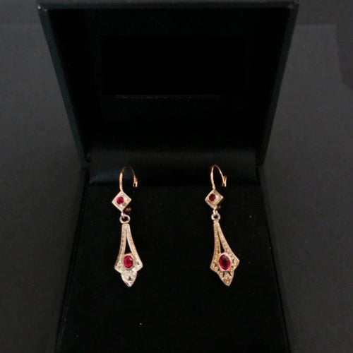 Boucles d'oreilles Boucles d’oreilles dormeuses en or 18 carats bicolore et pierres rouges 58 Facettes
