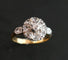 Bague 53 Bague marguerite ancienne en or jaune 18 carats, platine et diamants 58 Facettes