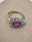 Bague 57 Bague en or blanc 18 carats avec rubis ovale et diamants 58 Facettes
