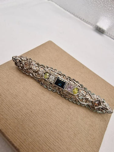 Broche Broche vintage en or blanc 18 carats sertie de diamants et saphir 58 Facettes