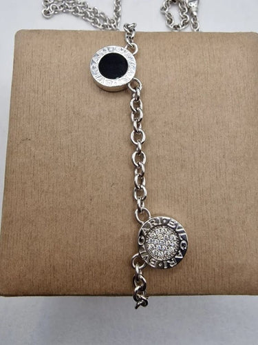 Collier Bvlgari Bvlgari - Collier double face en or blanc 18k, diamants et onyx 58 Facettes