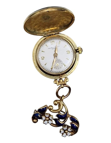 Montre Baume & Mercier - Broche montre en or jaune 18 carats et émail 58 Facettes