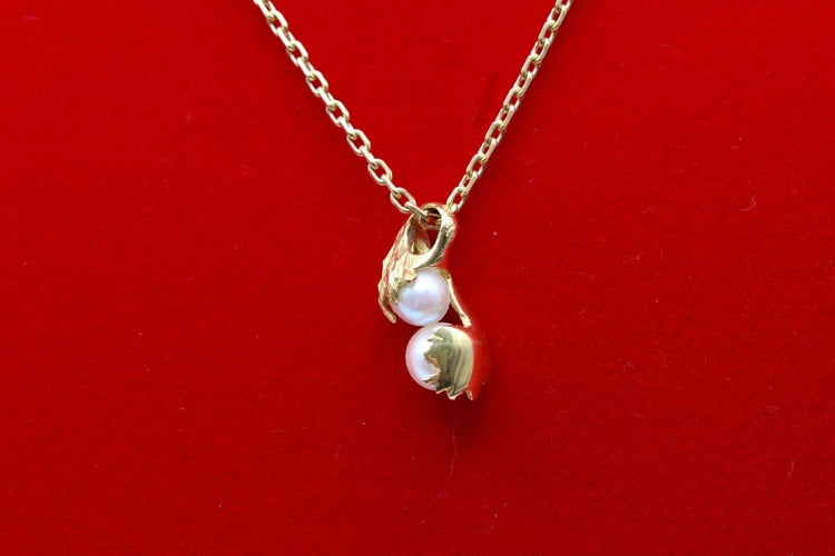 Pendentif Pendentif moderne en or jaune 750 et perles de culture 58 Facettes 240385