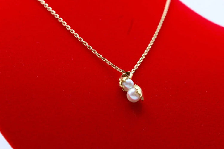 Pendentif Pendentif moderne en or jaune 750 et perles de culture 58 Facettes 240385