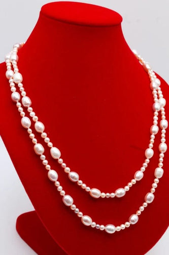 Collier Collier sautoir de perles d’eau douce roses et blanches 58 Facettes 240361