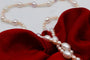 Collier Collier sautoir de perles d’eau douce roses et blanches 58 Facettes 240361