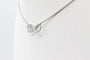 Collier Collier motif infini en or blanc 18 carats et diamants 58 Facettes 240410