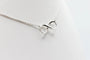 Collier Collier motif infini en or blanc 18 carats et diamants 58 Facettes 240410