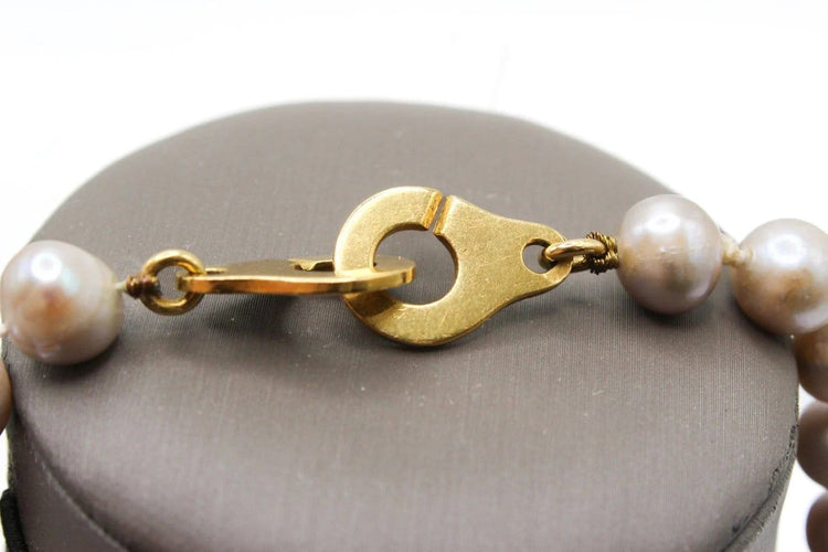 Collier Collier en or jaune et perles grises 58 Facettes 240134