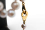 Collier Collier en or jaune et perles grises 58 Facettes 240134