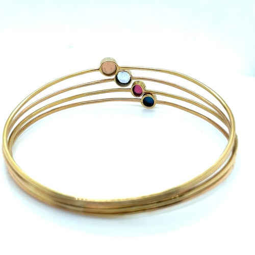 Bracelet Bracelet ancien à 4 joncs en or jaune 18 ct et pierres 58 Facettes