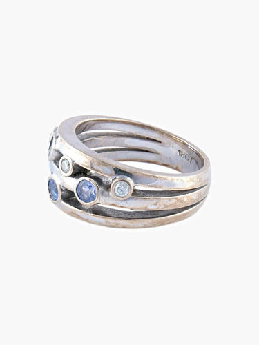 Bague 54 Bague bandeau en or blanc et diamants avec tanzanites 58 Facettes